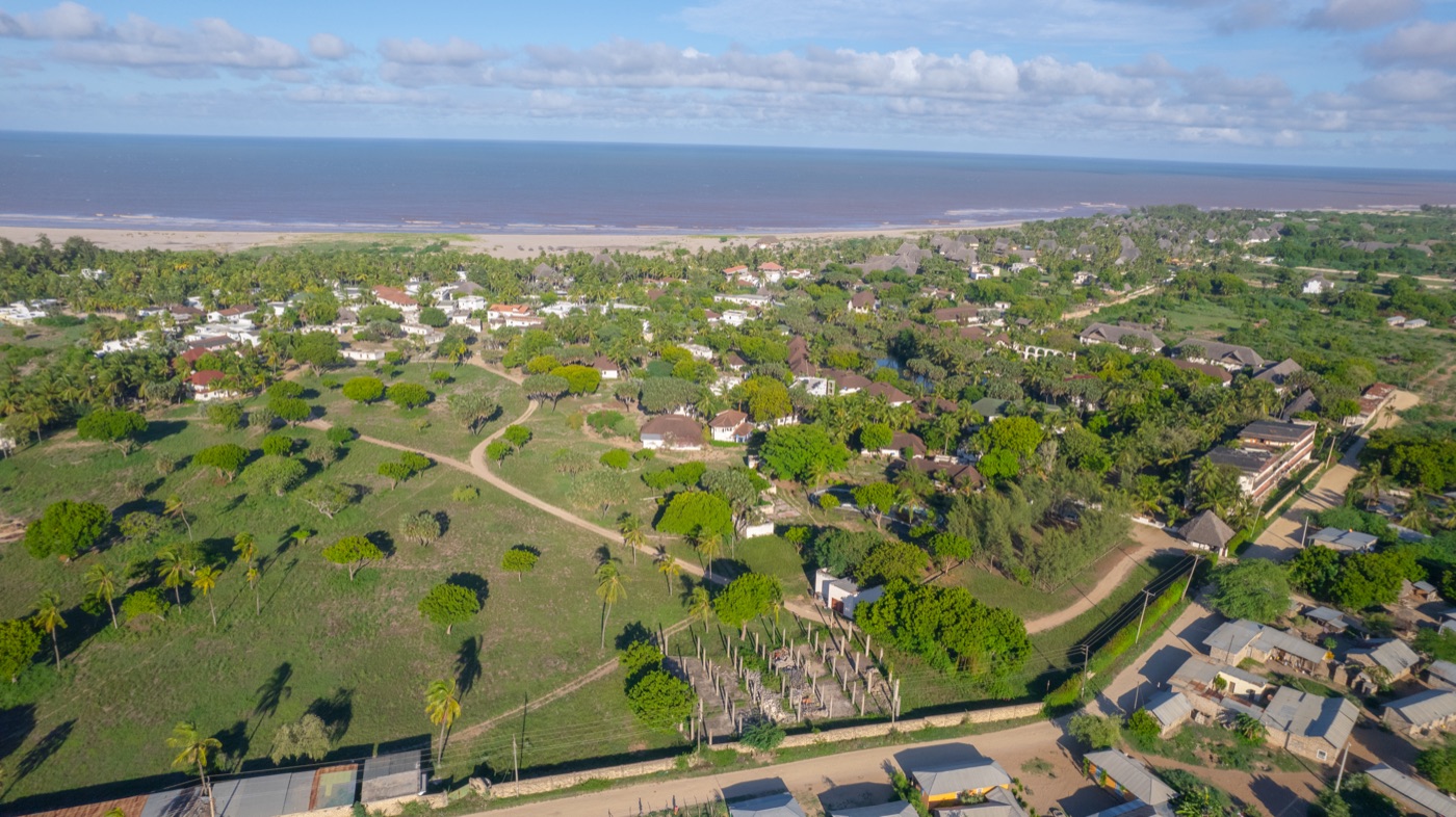 Drone conducting cadastral survey over agricultural land parcels